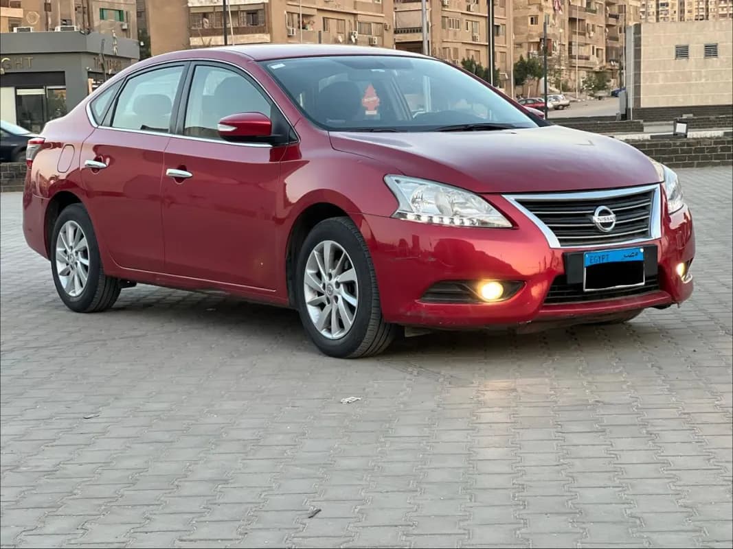 نيسان سنترا 2016 بريميم أحمر أوتوماتيك — مستعملة