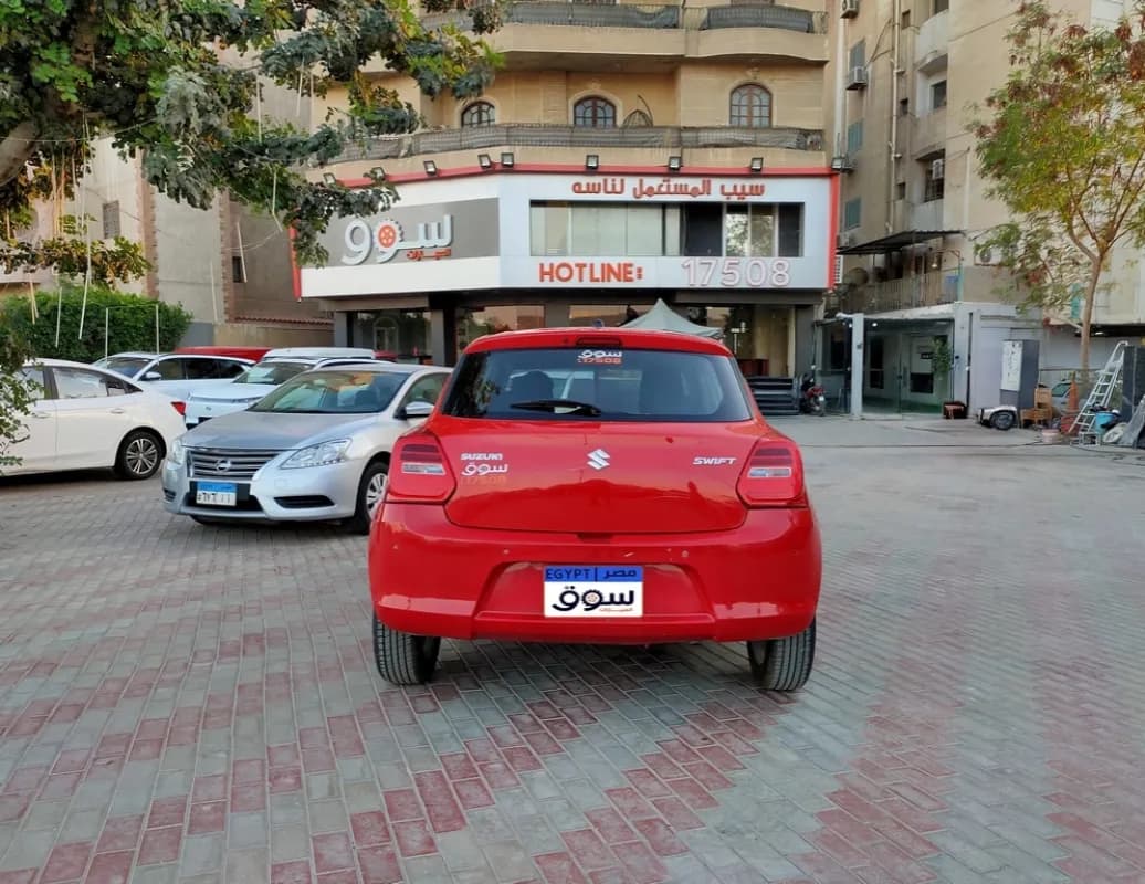 سوزوكي سويفت 2021 جي ال اكس أحمر أوتوماتيك — مستعملة