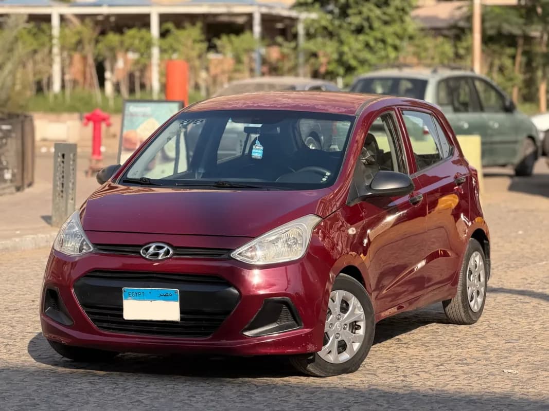 هيونداي جراند I10 2015 جي ال أحمر غامق أوتوماتيك — مستعملة